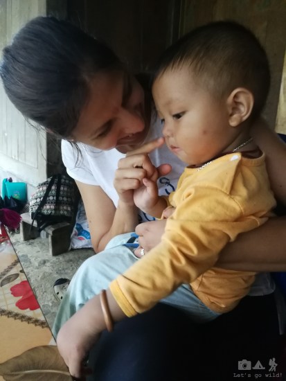 Playing with the son of May, our wonderful guide